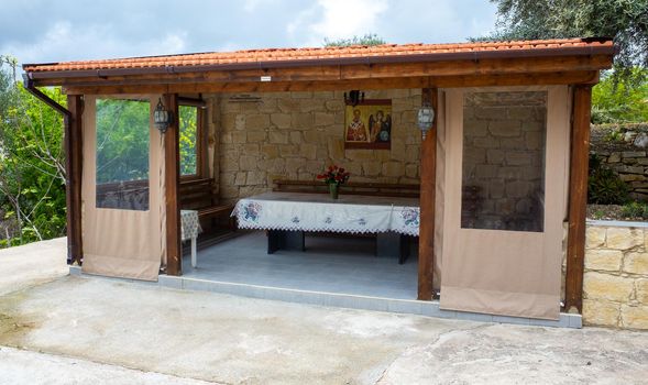Gazebo for eating in the courtyard of a Christian Church in a mountain Village on the island of Cyprus.