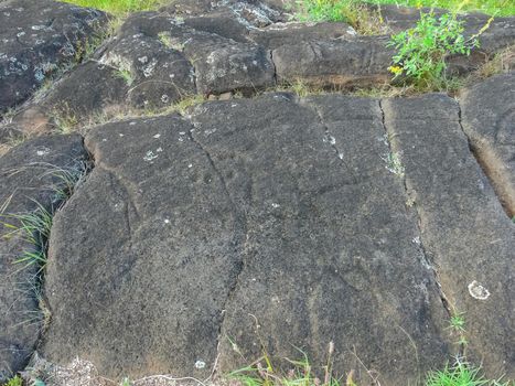 Stone slabs with drawings on Easter Island. Traces of stone processing on plates.