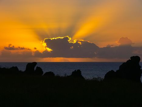 Sunset on Easter Island. The colors of sunset in the ocean.