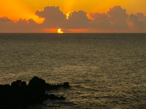 Sunset on Easter Island. The colors of sunset in the ocean.