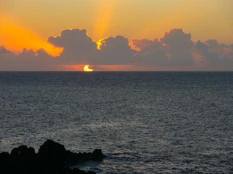 Sunset on Easter Island. The colors of sunset in the ocean.