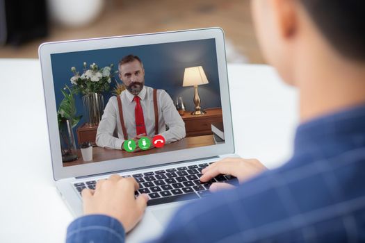 Young asian businessman video conference and discussion with businessman, man work from home with laptop computer with social distancing, meeting online, communication and business concept.