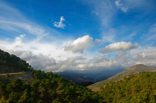 Green mountains and blue sky with clouds, view from the top, spring, Spain