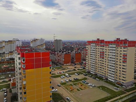 High view of residental area with multi-storey buildings and parking, autumn, Russia