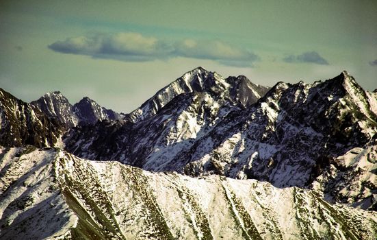 Mount Sayan in winter in the snow. The nature of the mountains is sayan.