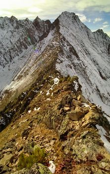 Mount Sayan in winter in the snow. The nature of the mountains is sayan.