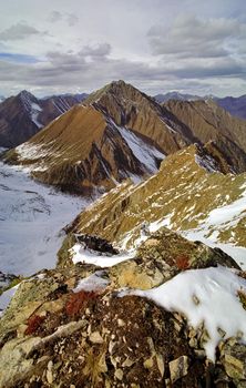 Mount Sayan in winter in the snow. The nature of the mountains is sayan.