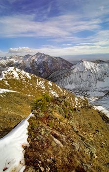 Mount Sayan in winter in the snow. The nature of the mountains is sayan.