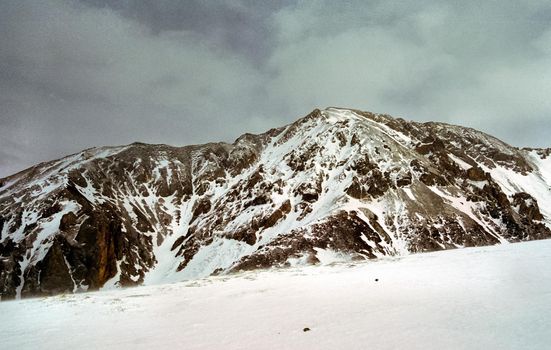 Mount Sayan in winter in the snow. The nature of the mountains is sayan.