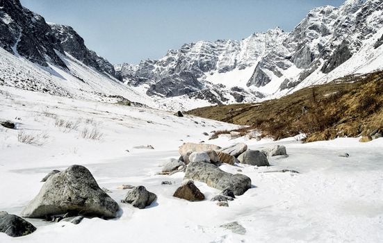 Mount Sayan in winter in the snow. The nature of the mountains is sayan.