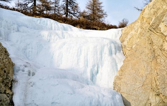 Mount Sayan in winter in the snow. The nature of the mountains is sayan.