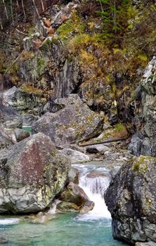 Mountain river. Stones and water of a mountain river. The mountains are said.