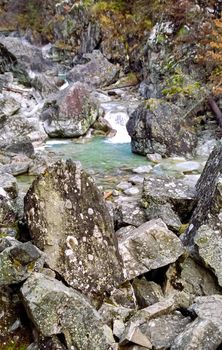 Mountain river. Stones and water of a mountain river. The mountains are said.