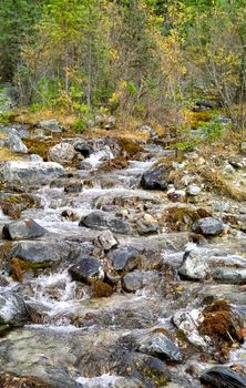 Mountain river. Stones and water of a mountain river. The mountains are said.