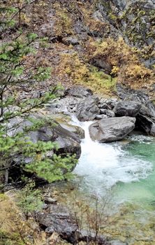 Mountain river. Stones and water of a mountain river. The mountains are said.