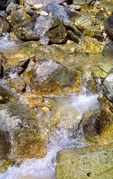 Mountain river. Stones and water of a mountain river. The mountains are said.