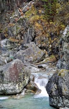 Mountain river. Stones and water of a mountain river. The mountains are said.