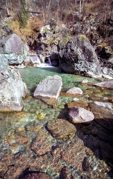 Mountain river. Stones and water of a mountain river. The mountains are said.