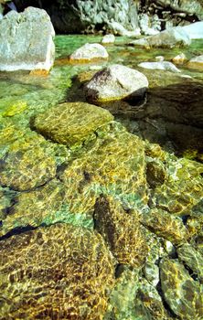 Mountain river. Stones and water of a mountain river. The mountains are said.