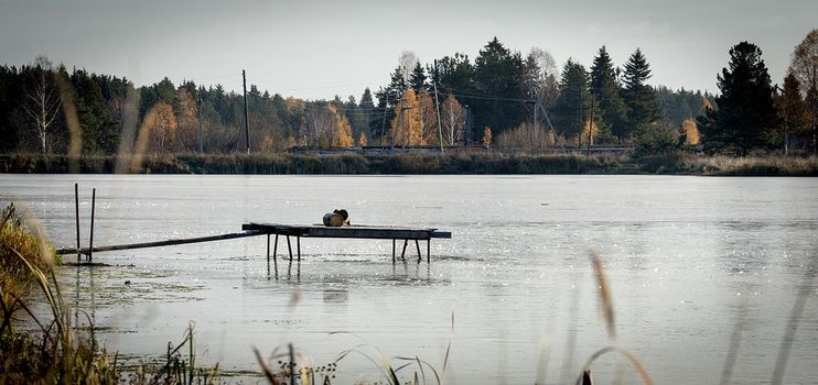 fishing pier on the lake. empty pier on the pond.