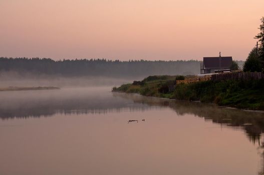 Smoke of mist over the pond. morning mist over the pond.