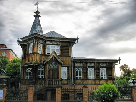 The wooden second floor of the house. Wooden architecture.