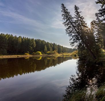 Lakes in the autumn forest. Forest autumn landscape, beautiful nature.