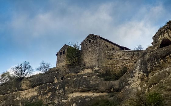 At home near the rocks. Stone houses in a mountain village. Crimea