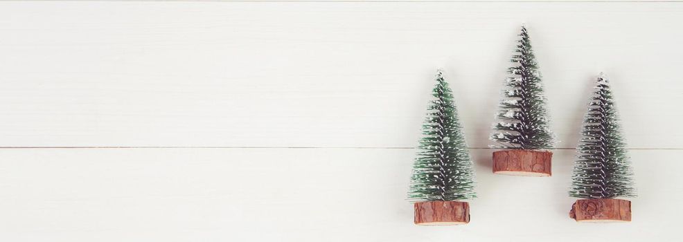 Christmas holiday composition decoration with pine tree on wooden background, new year and xmas or anniversary with presents on wood table in season, top view or flat lay, copy space, banner website.