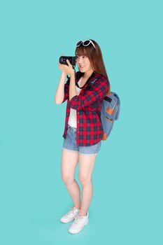 Beautiful young asian woman smiling is journalist photographer wear fashion travel summer, girl holding camera hobby tourist and trip in vacation and holiday isolated on blue background.