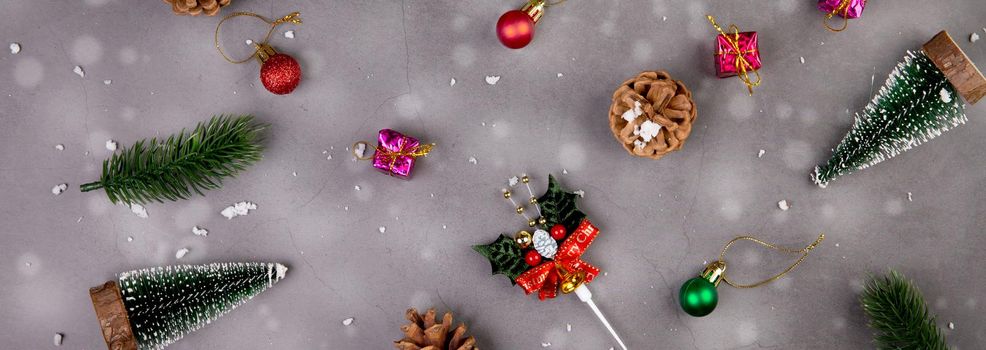 Christmas holiday composition with gift box and snow decoration, new year and xmas or anniversary with presents on cement floor background in season, top view or flat lay, copy space, banner website.