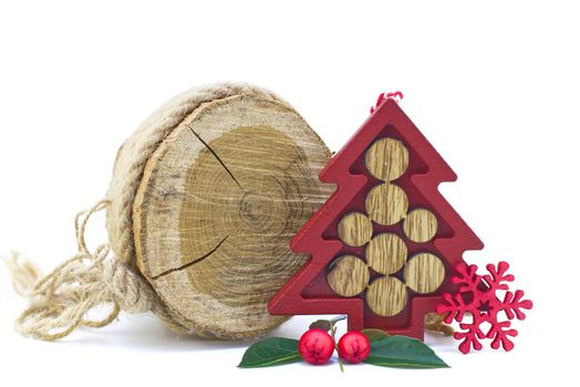 Wooden decorations for christmas with small red christmas tree isolated on white background. Set of handmade objects for holiday season interior or gift decoration