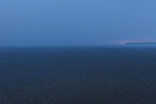 A downpour over the water surface of the overlook. The gurgles of water. Water splashes and drops.