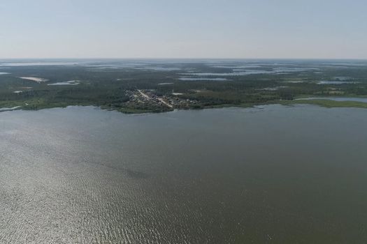A village near a lake in the taiga. The village of Numto in Ugra.