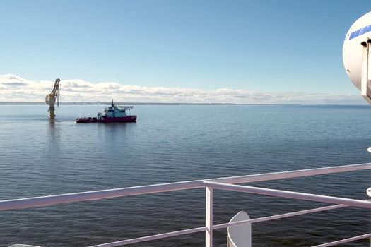 Arctic navigation in the summer. Service ships at sea.
