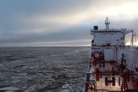 The feed of a ship sailing in the Arctic. Landscape of the Arctic from the deck of the tanker.