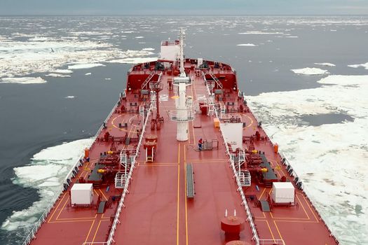 The feed of a ship sailing in the Arctic. Landscape of the Arctic from the deck of the tanker.