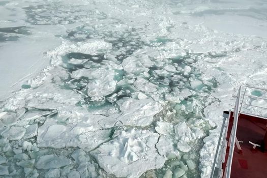 The feed of a ship sailing in the Arctic. Landscape of the Arctic from the deck of the tanker.