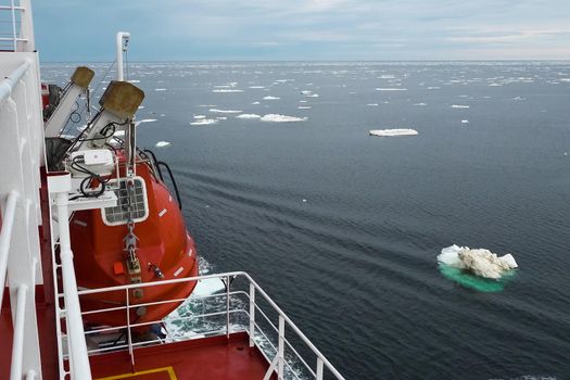 The feed of a ship sailing in the Arctic. Landscape of the Arctic from the deck of the tanker.