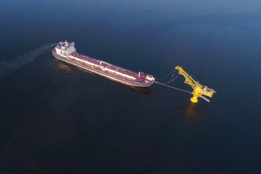 The tanker is filled with liquefied natural gas, transporting gas by sea.