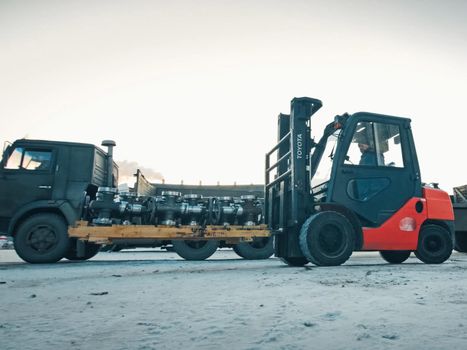 Moscow, Russia - January 23, 2019: Transporting oil catches on a loader.