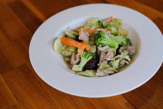 vegetable, broccoli, carrot, lettuce, baby corn and mushroom stir fried with pork