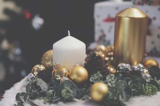 golden christmas balls. festive ornament decoration. candle, conifer cone