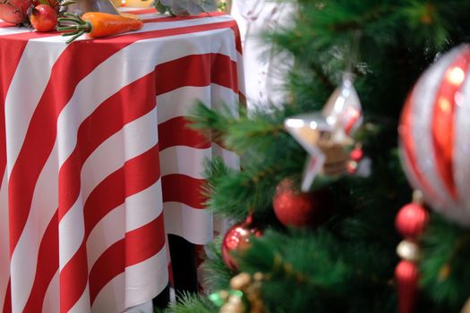 red white striped fabric tablecloth with festive christmas ornament decoration. xmas festival