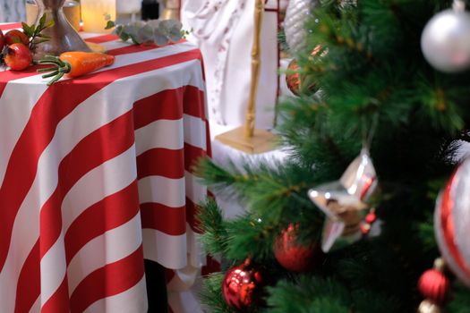 red white striped fabric tablecloth with festive christmas ornament decoration. xmas festival