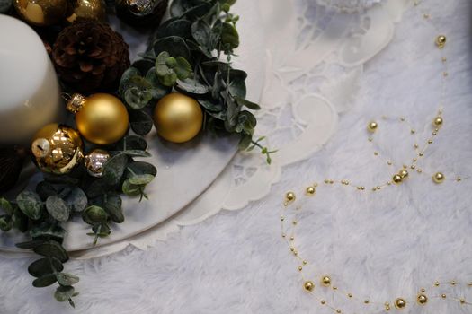 golden christmas balls. festive ornament decoration. candle, conifer cone
