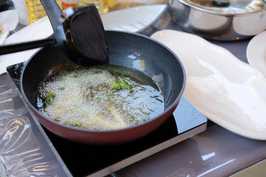 deep fried vegetable cooking in frying pan.