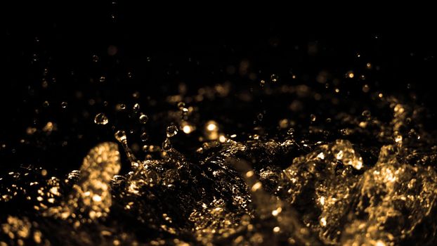 Hi speed close up images of oil liquid from diesel gasoline splashing and moving up to the air on black background for represent power of fuel liquid that active and powerful. studio shot premium gold color tone.