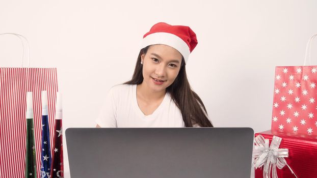 Christmas online holiday celebration with teenage asian woman. Party X mas and new year in lockdown coronavirus quarantine covid 19 new normal, social distance, remote communication, stay home vocation, Christmas party online