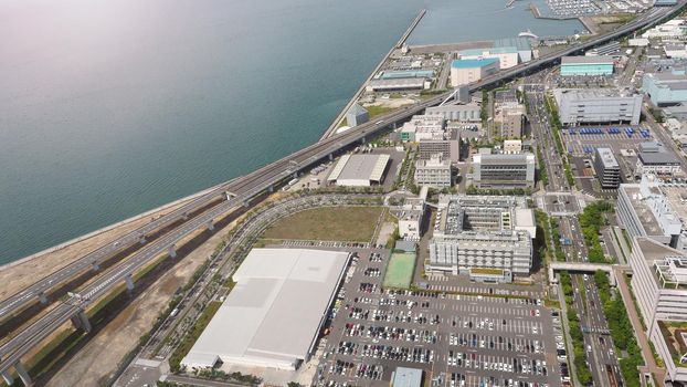 Aerial view or bird eyes view images of Kansai bay area Osaka Japan include big premium outlets located across from Kansai International Airport and it's largest airport in western Osaka bay Kansai Japan. 